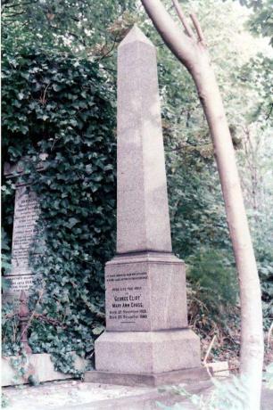 Obelisco di pietra in un giardino recante un'iscrizione che commemora Eliot