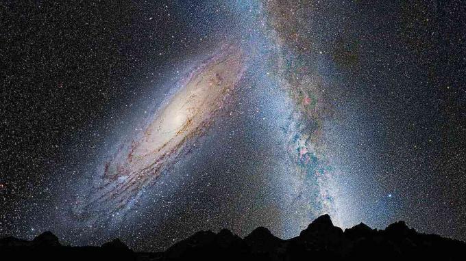 Andromeda e la Via Lattea si scontrano, visto dalla superficie di un pianeta all'interno della nostra galassia.